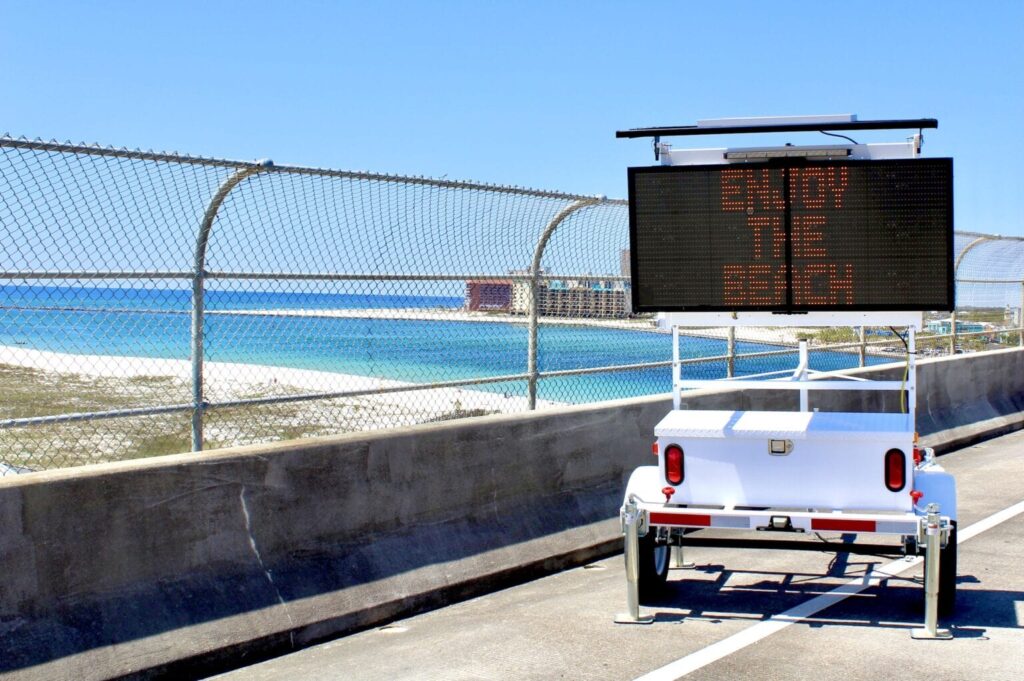 Orange beach using their message board sign to wish visitors a good time at the beach.