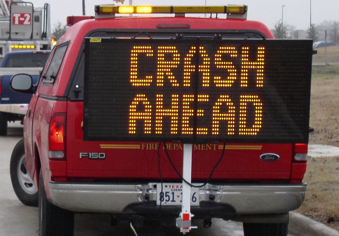 VMS Board on the hitch of a truck warning of crash