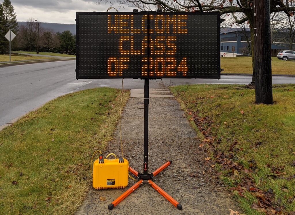 Variable Message Board on a portable post welcoming students on college move-in day